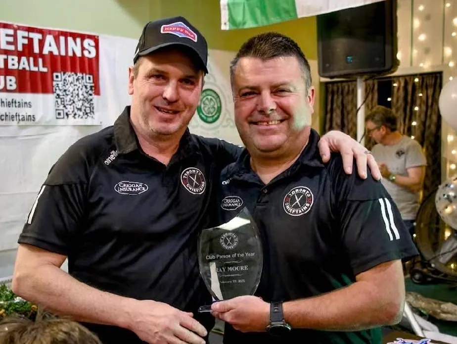 Ray receiving a community club award